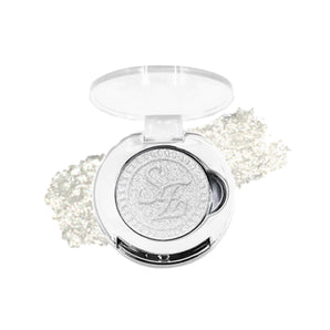 SheenEffect single eyeshadow in an open compact with a shimmery silver-white pan and swatches behind