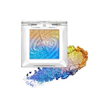 NOIRICORN Astral Archive Pigment Singles eyeshadow in Solar Tide, shown in a clear square compact with multicolor swatches