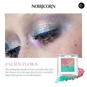 NOIRICORN Alien Flora single eyeshadow compact with pink-green shimmer swatch and eye makeup close-up