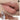 ANTHEMY lip gloss in Bionic Code nude apricot, shown on lips with applicator and tube