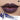 ANTHEMY Erosion Matrix Lip Gloss in #G04 Blue Ink, blue-purple shimmer on lips with applicator