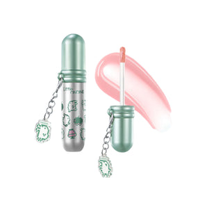 Little Ondine Tamagotchi Pixel Pals lip glaze with mint capsule packaging, applicator, charm, and pink gloss swatch
