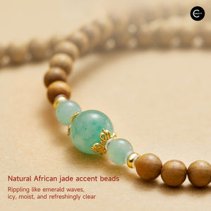 The Palace Museum beaded bracelet with green accent beads and brown wood beads, close-up view