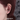 Model wearing a red-eye black spider earring by Doach Style
