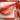 MEEYA SHOW glitter lipstick in a warm coral-red shade with a close-up lip swatch