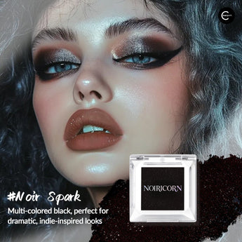 NOIRICORN Noir Spark duochrome eyeshadow compact with black shimmer swatch and dramatic eye makeup close-up