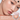 SPENNY blush in shade 928 Coral Snow shown in an open compact beside a model wearing the shade
