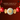 Red, jade, and gold decorative ornament with a coin motif and bat-pattern accessories