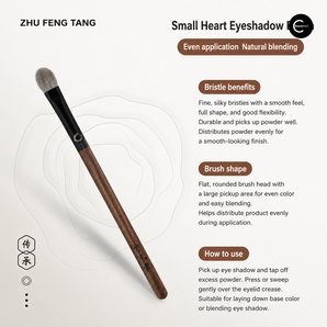 Zhu Feng Tang eye shadow brush with brown wood handle and rounded gray bristles